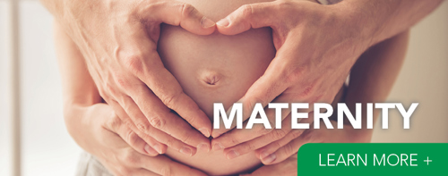 Pregnant woman with man holding stomach