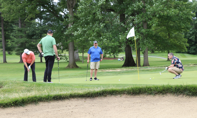 Team putting on the green