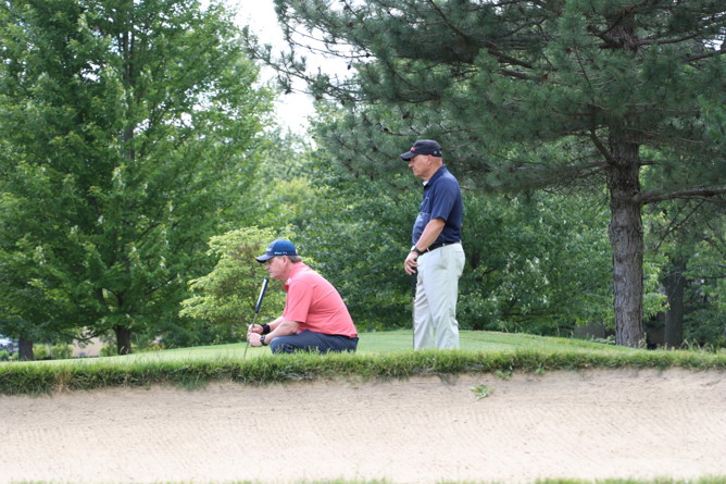 golfers watching