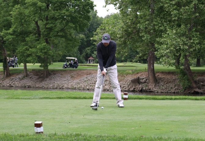 Dr. Morris teeing off