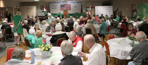 Volunteer banquet volunteer sitting at tables