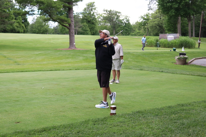 man watching his teed off ball fly